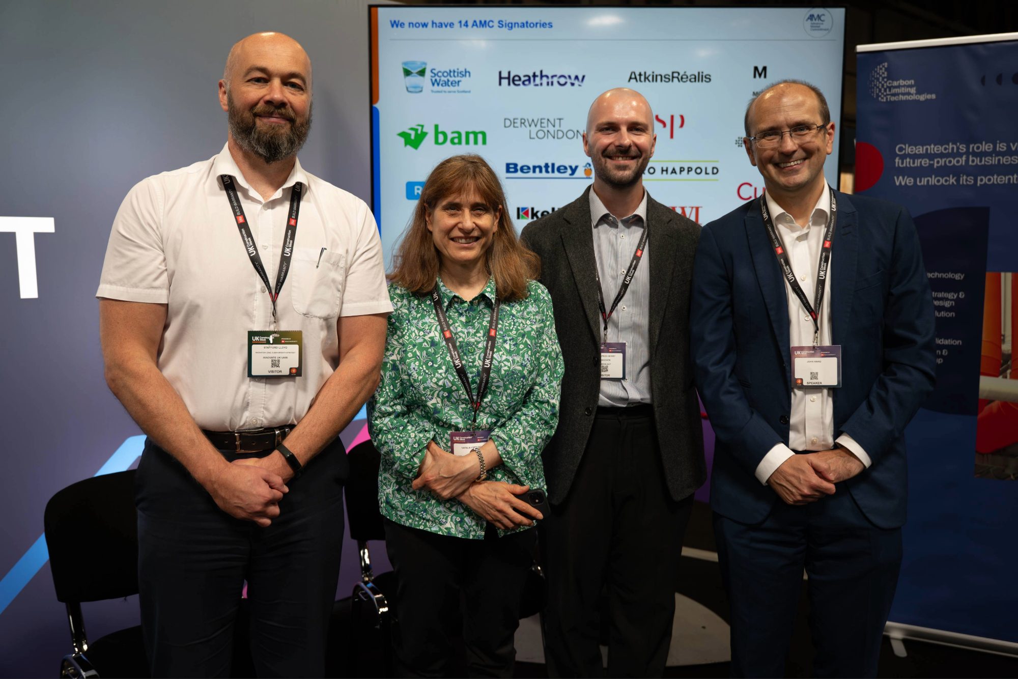 Advance Market Commitment (AMC) group standing together at the UK Construction Week’s Build Connect Lounge.